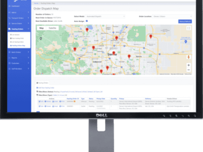 A Dell monitor displaying custom cloud-based software with a geographic map