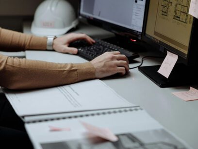 A close-up photo of a person using construction software on a computer