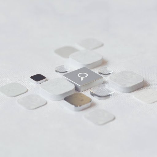 Image of white and silver square elements on a white surface